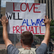A Protester holds a sign during a counter protest against a rally held by the KKK affiliated group Honorable Sacred Knights of Indiana at Courthouse Square on May 25, 2019 in Dayton, Ohio.